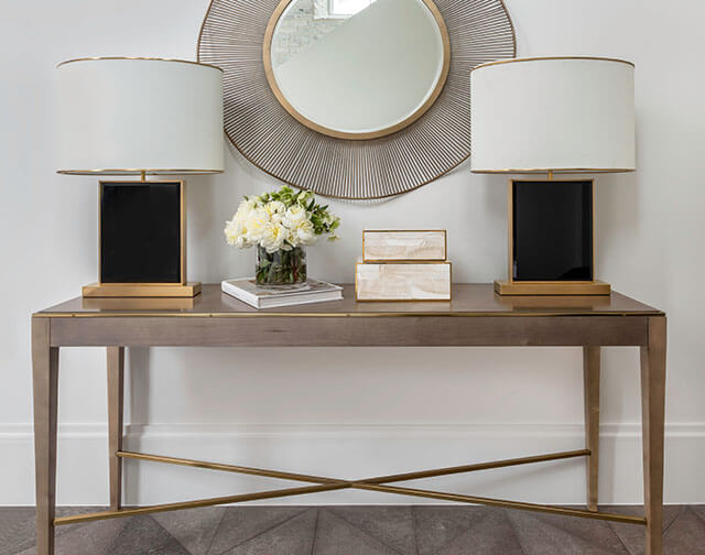 Carrara marble kitchen with luxury range and custom pot holder detail in Houston, TX